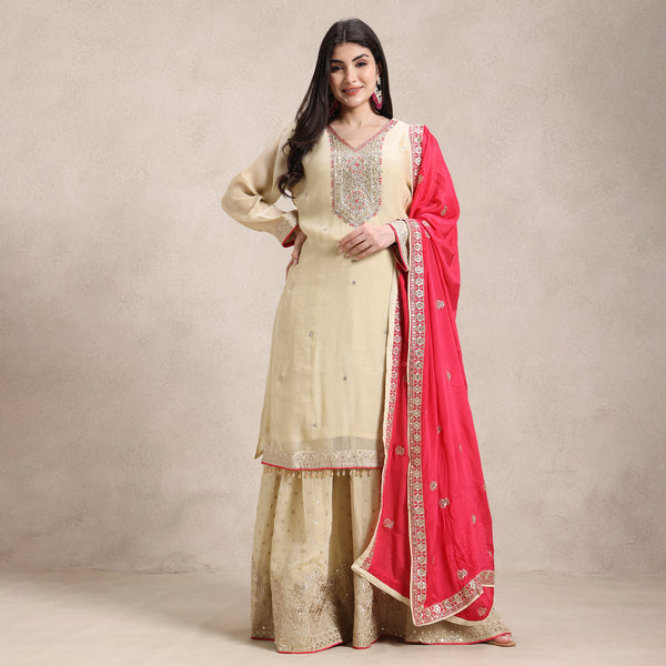 La Radi shimmer suit with pure zardozi hand work
