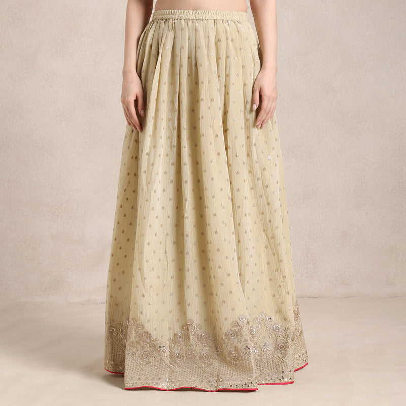 Beige long skirt with floral embroidery on a beige background