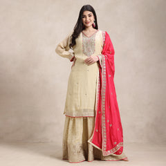 La Radi shimmer suit with pure zardozi hand work