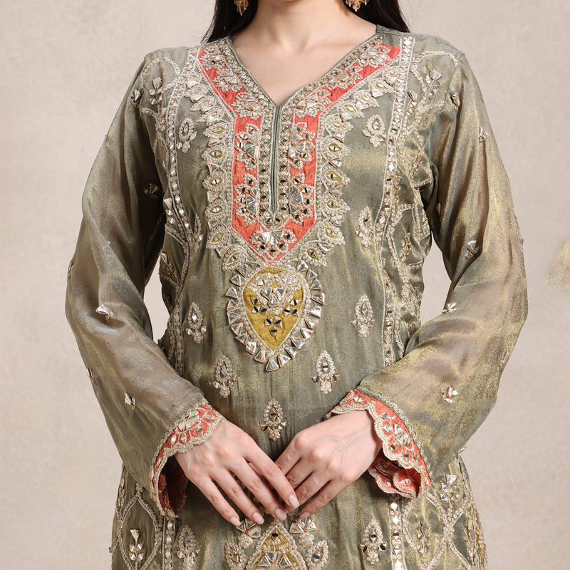 La Radi shimmer gharara set with gotta patti neckline close‑up